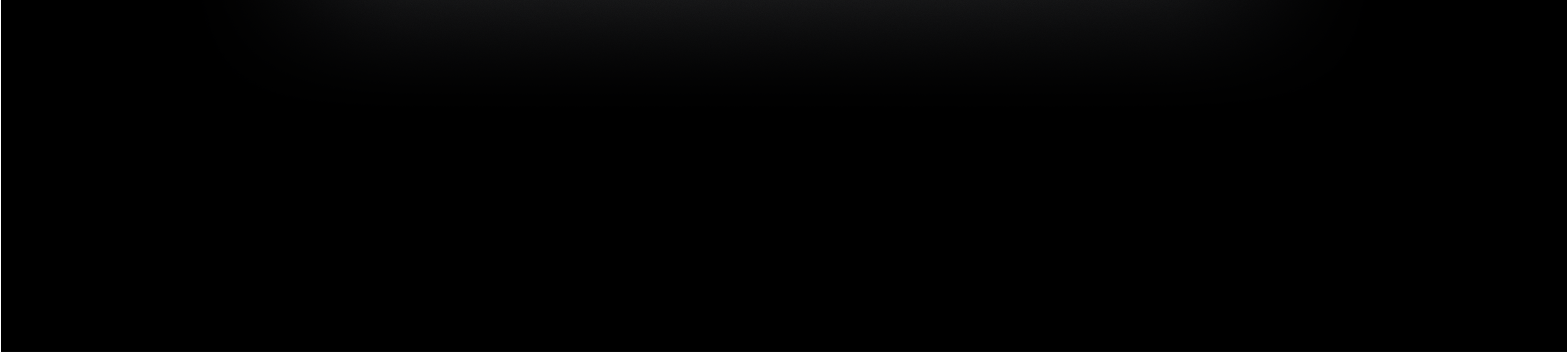 Widok oświetlonego Maca mini z tyłu